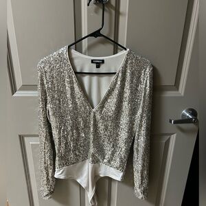 Champagne colored sequence bodysuit.